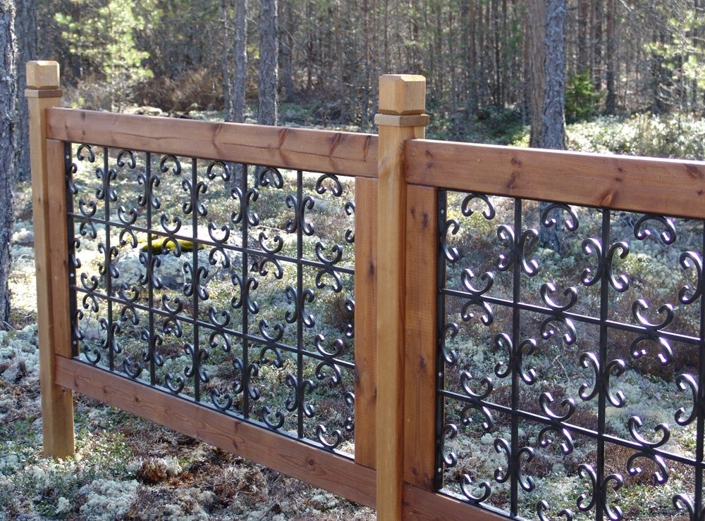 Wrought iron fence with wooden frames